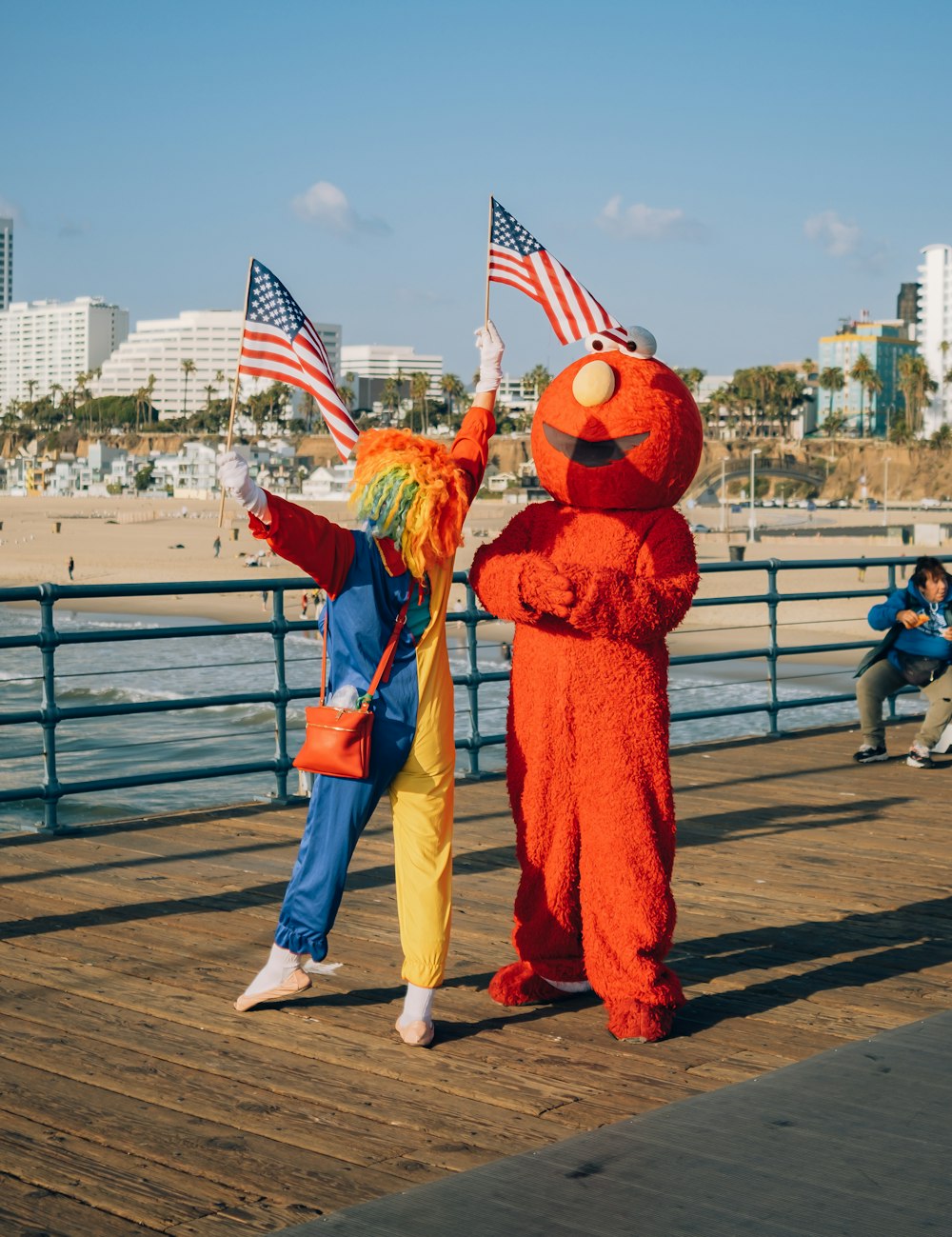 a couple of people that are standing on a pier