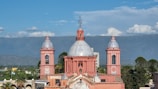 a large building with two towers and a dome