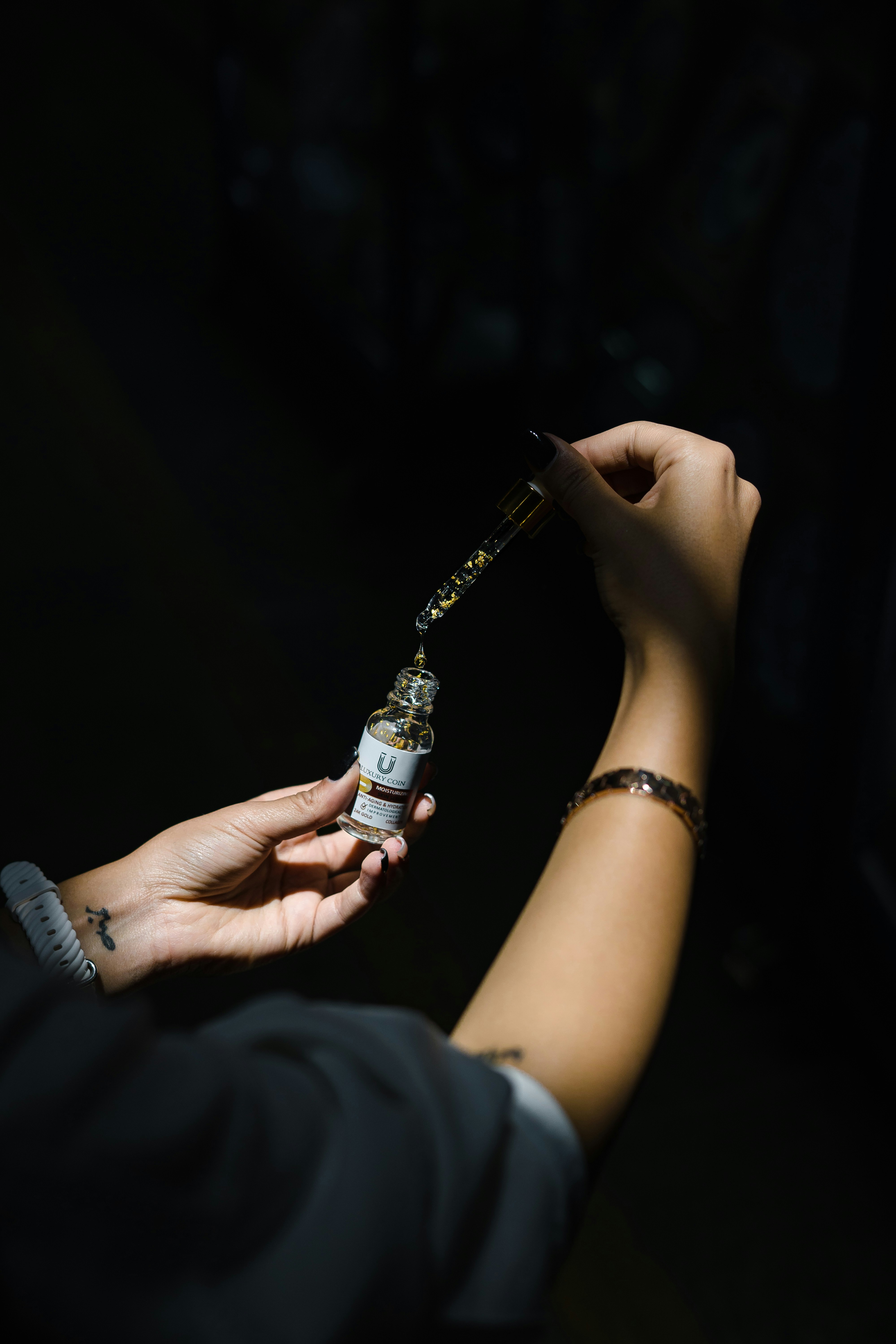 a person holding a small electronic device in their hand