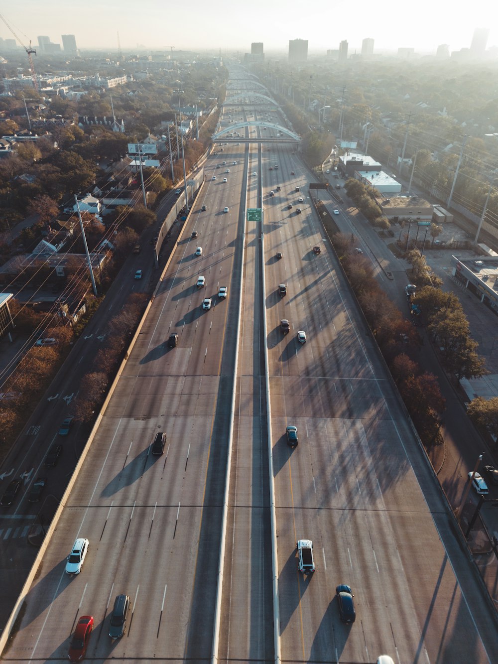 an aerial view of a highway with cars driving on it