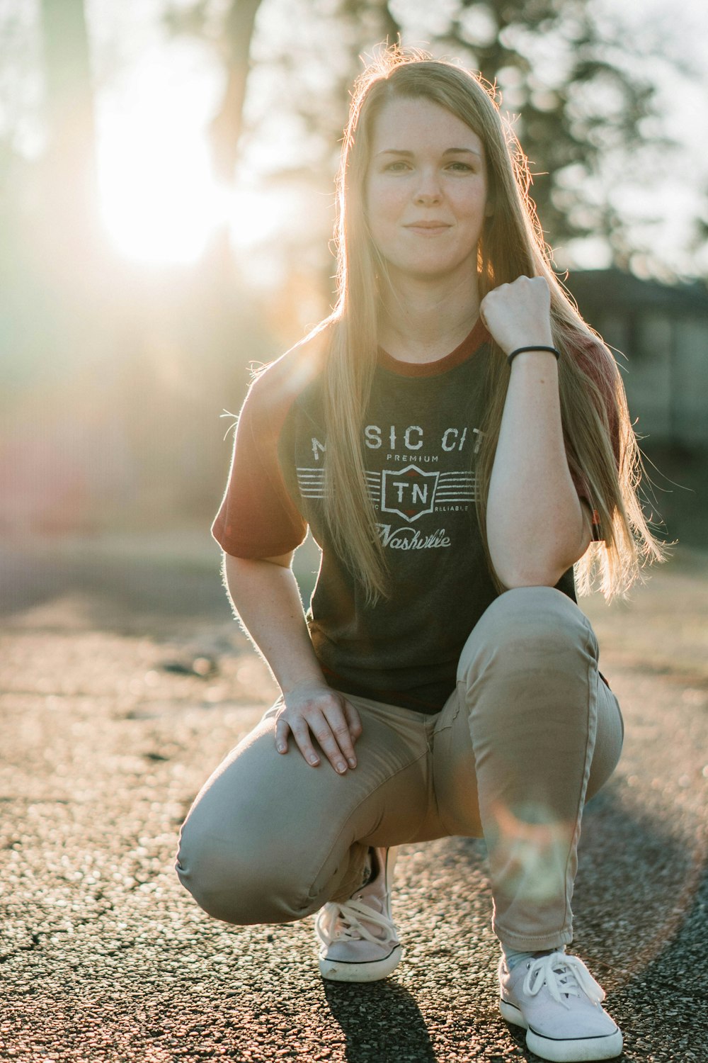 a young woman poses for a picture in the sun