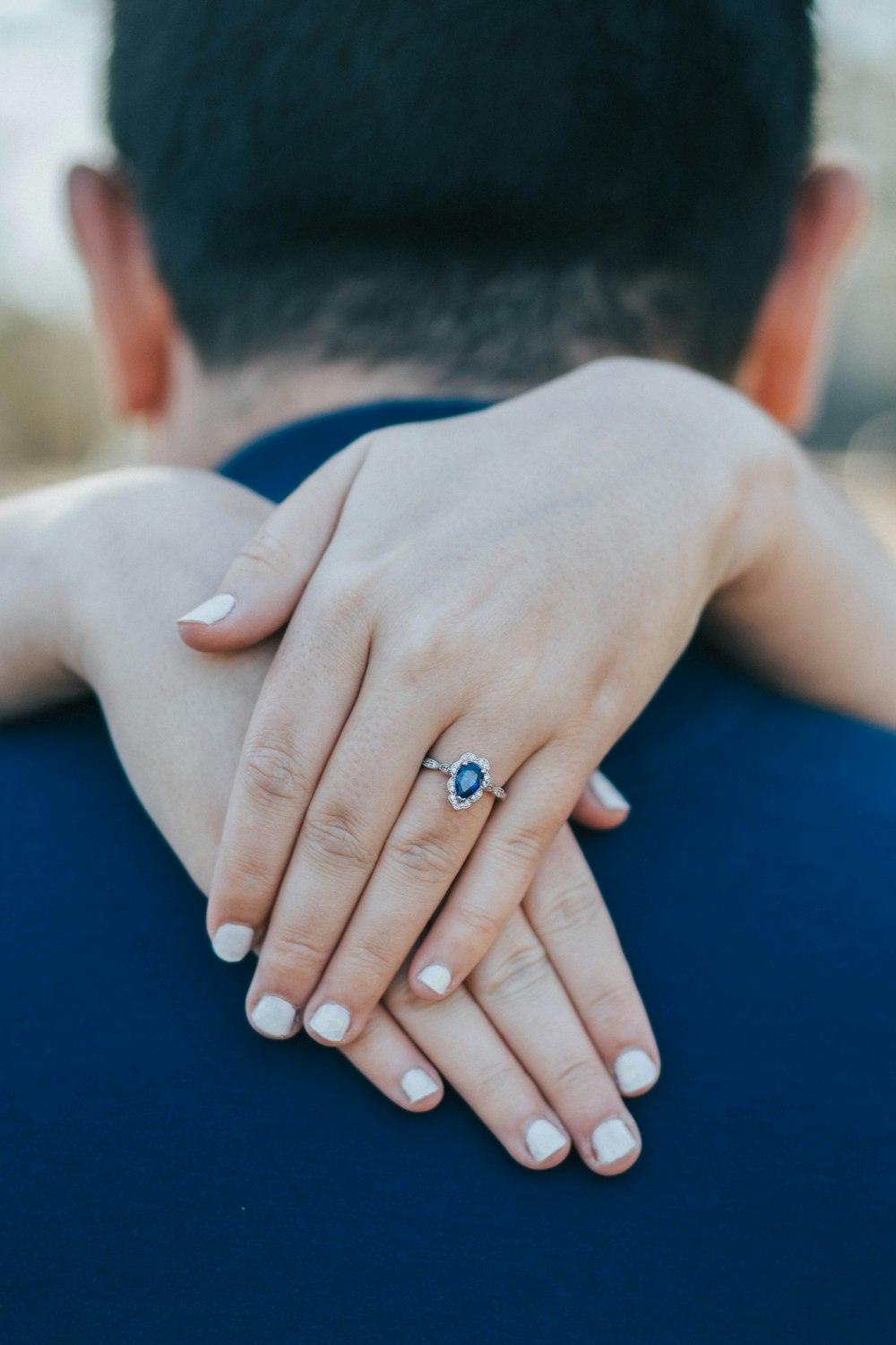 a close up of a person holding another person's hand