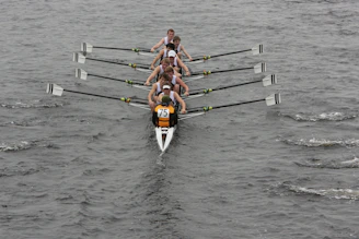 a group of people on a boat in the water