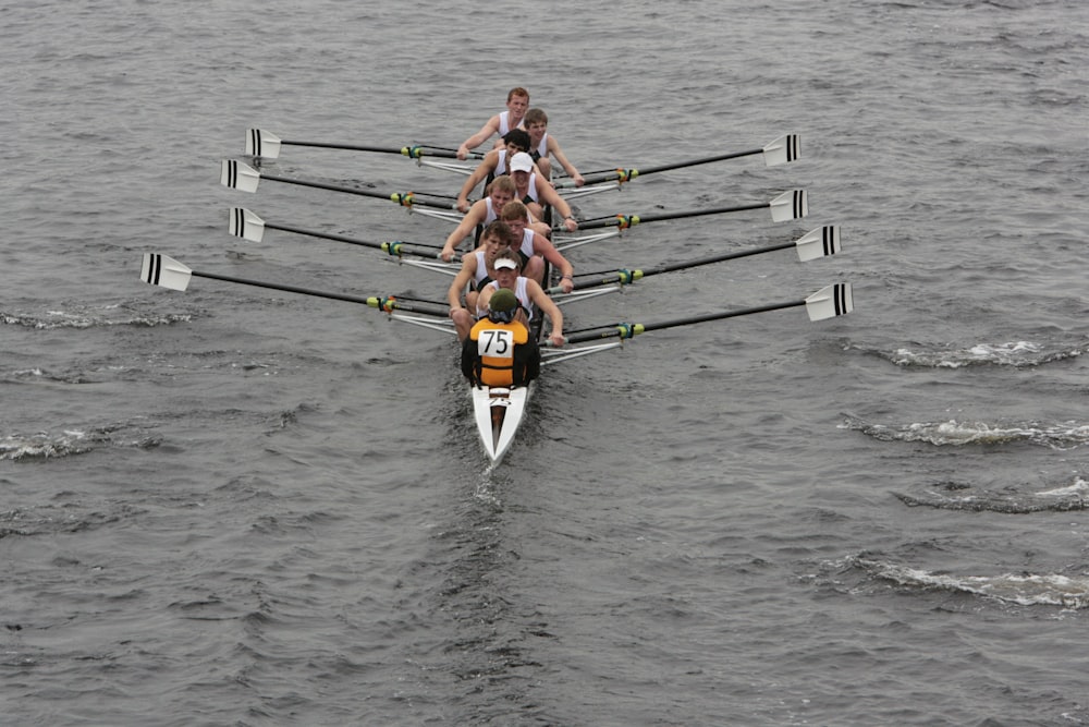 a group of people on a boat in the water