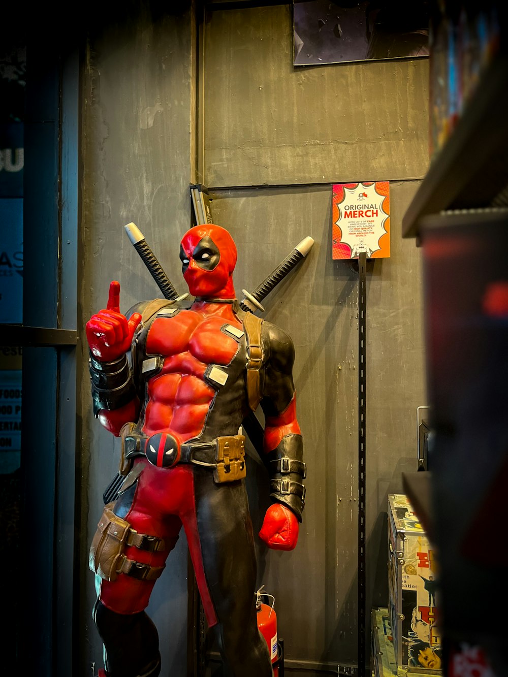 a statue of a man dressed as a deadpool