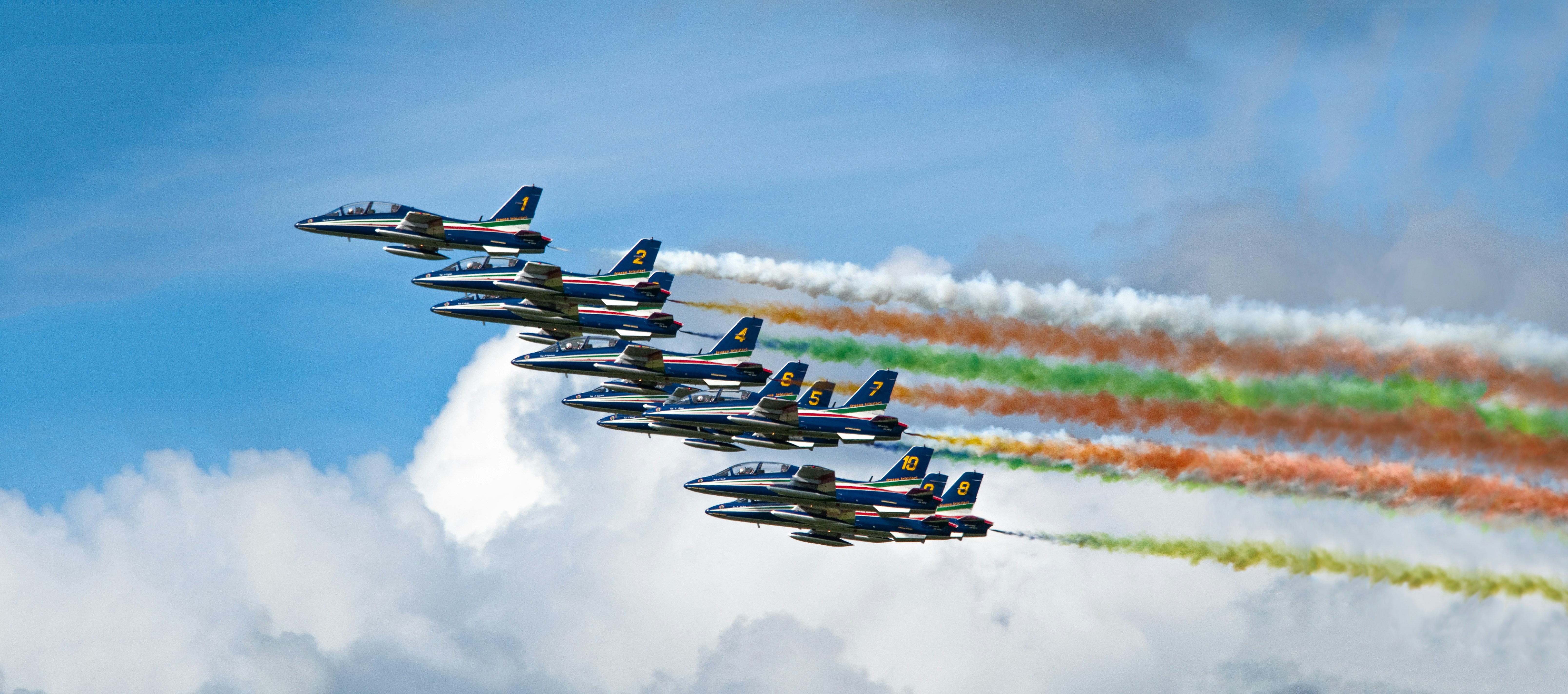 a group of fighter jets flying in formation