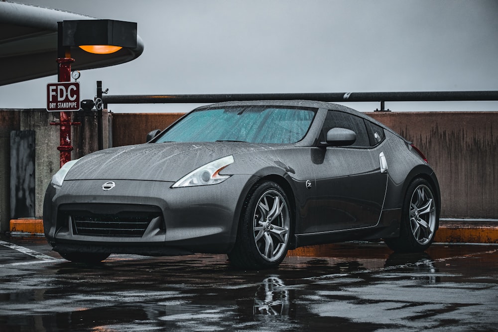 a silver sports car parked in a parking lot