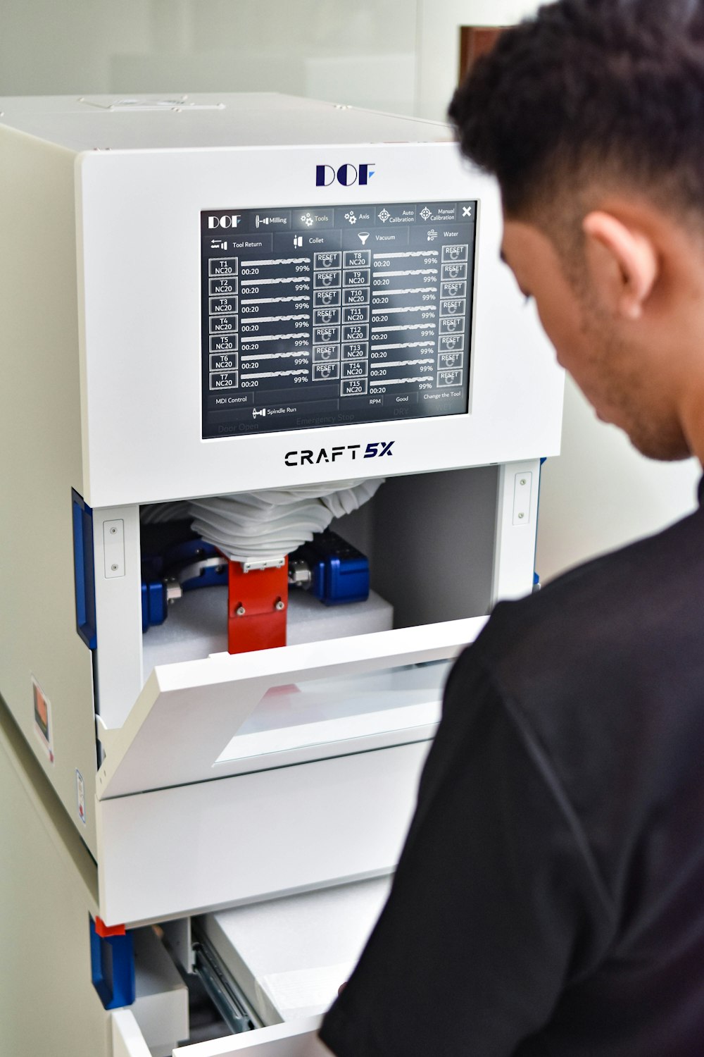 a man working on a machine in a lab