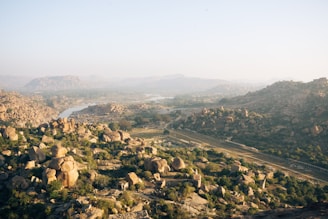 a view of a valley with a river running through it