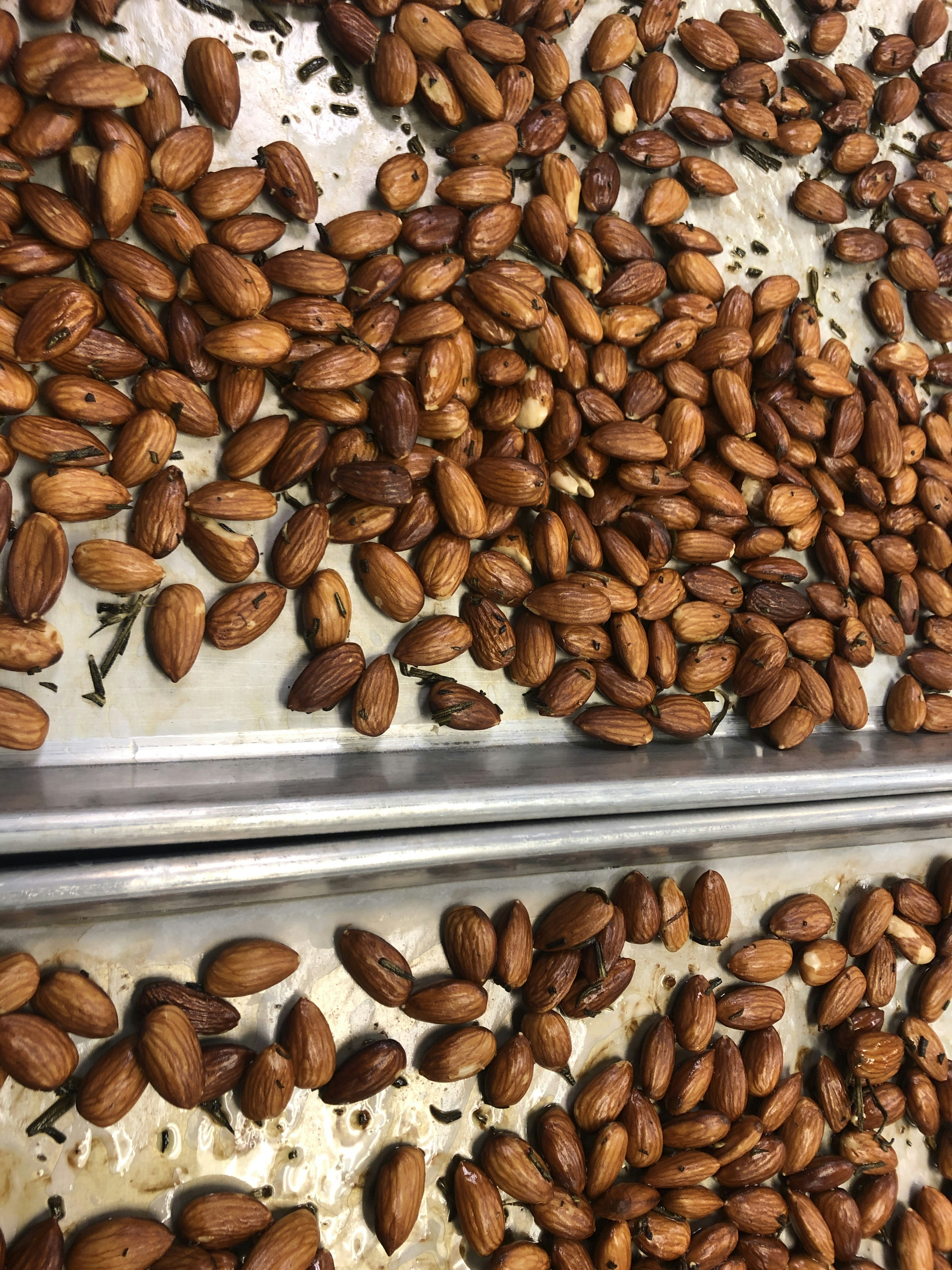 a pile of nuts sitting on top of a metal tray
