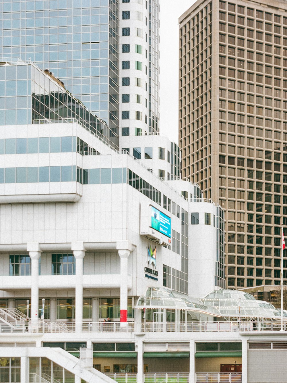 a large white building in the middle of a city