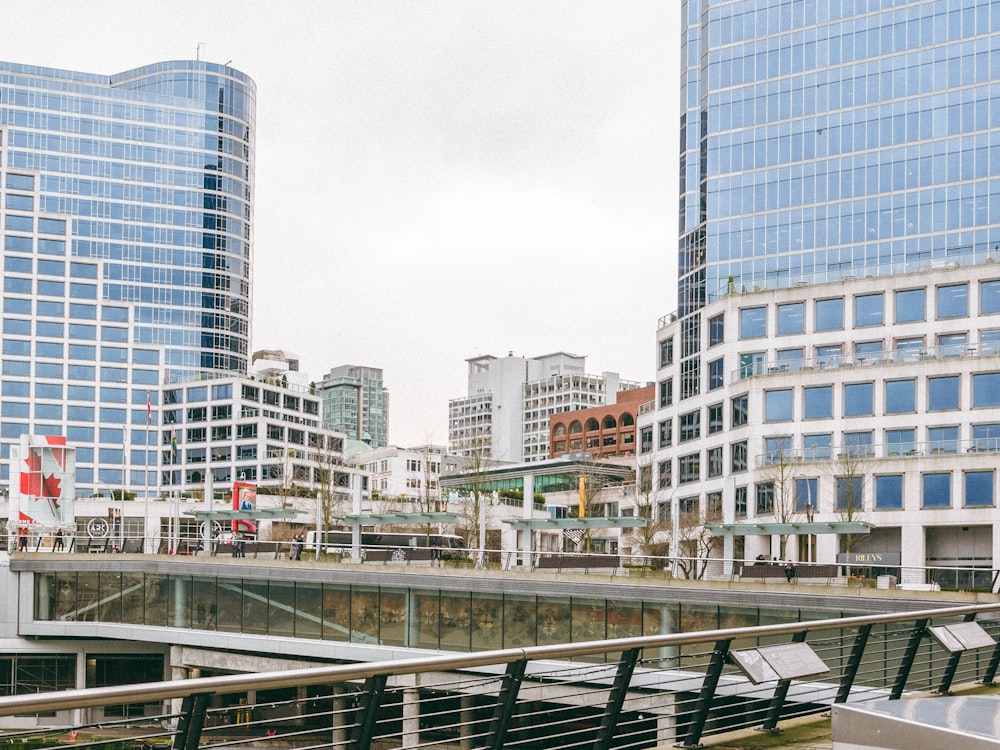 a city with tall buildings and a bridge