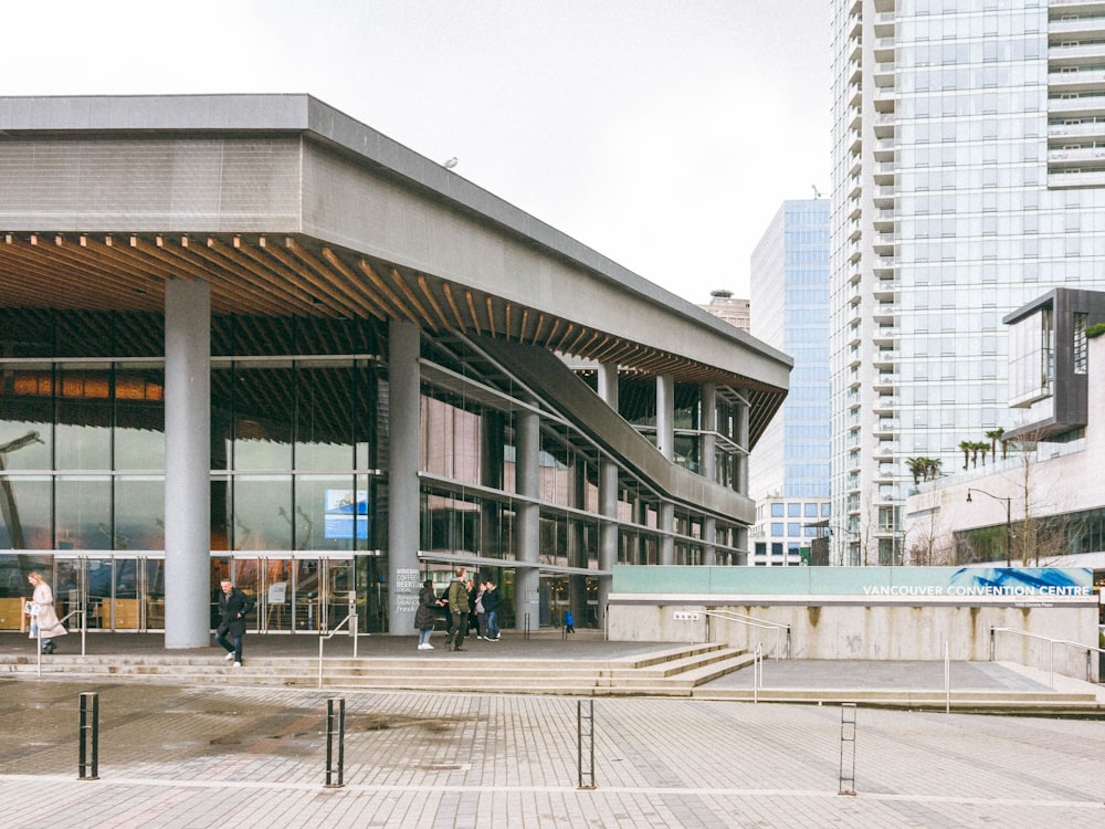 a group of people standing outside of a building