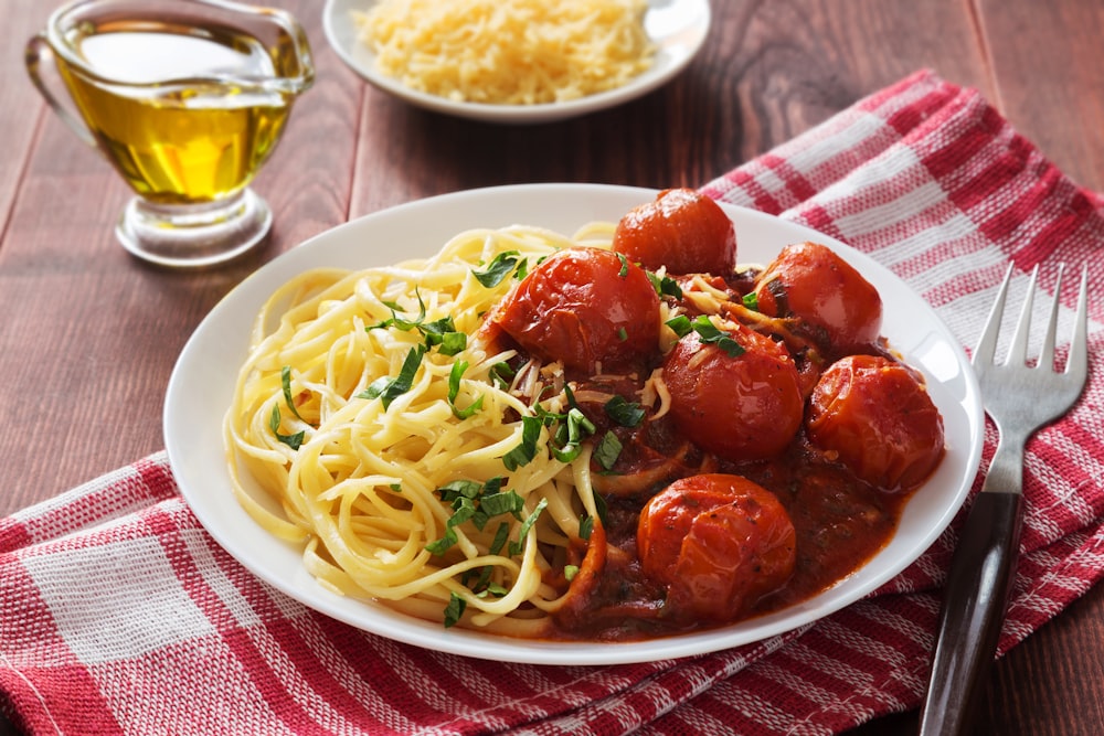 a plate of spaghetti with meatballs and sauce