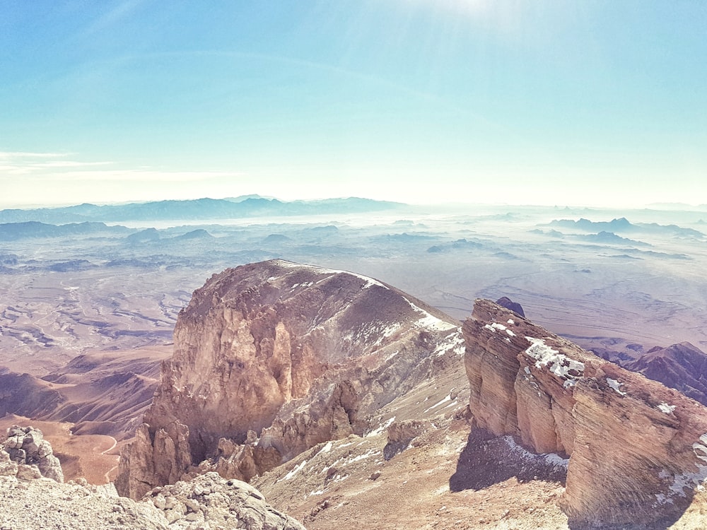 a view of a mountain range from the top of a mountain