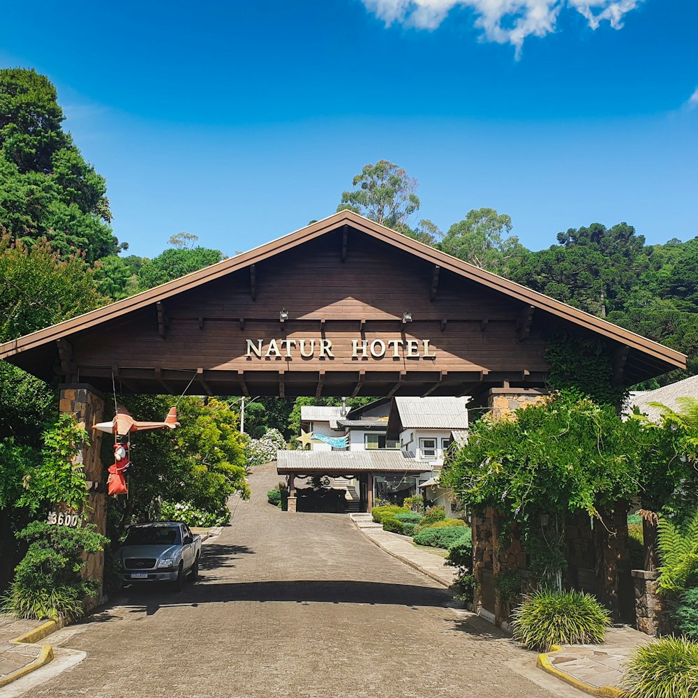 a woman standing in front of a hotel entrance