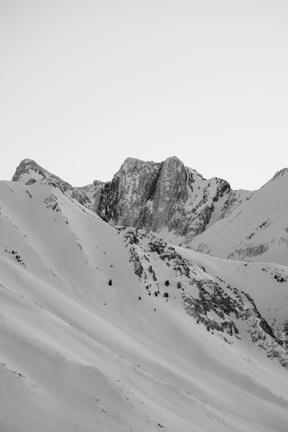 a black and white photo of a mountain range