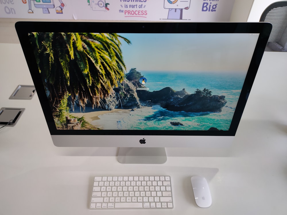 a computer monitor sitting on top of a desk