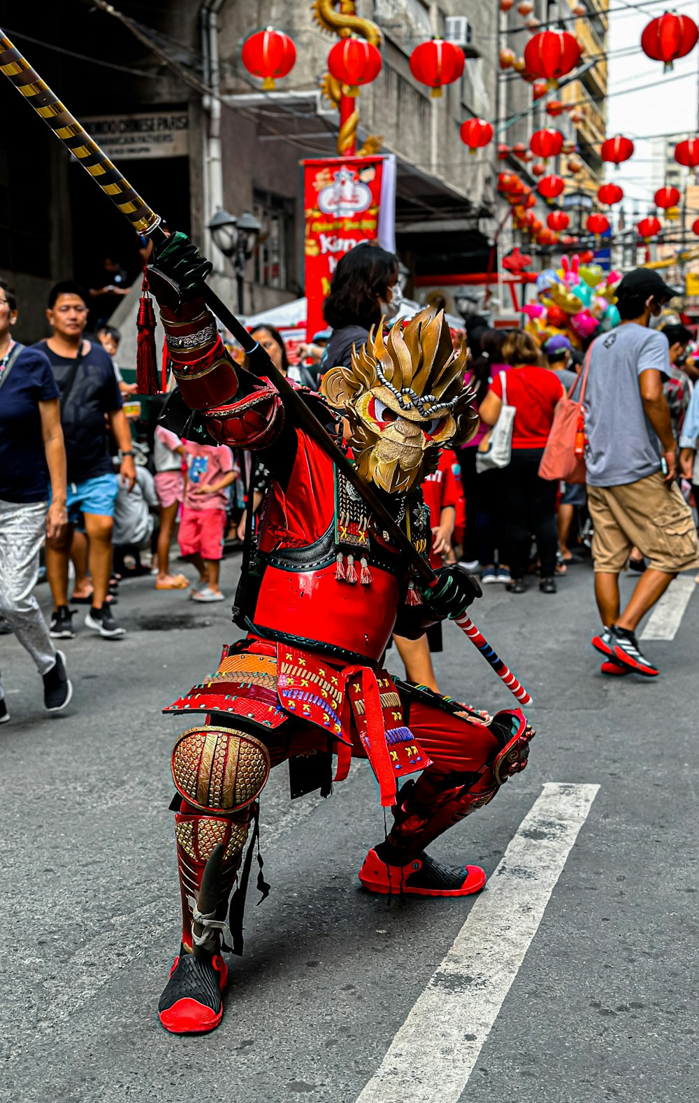 a person in a costume riding a bike down a street