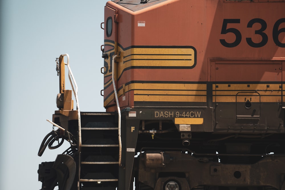 a train engine sitting on top of a train track