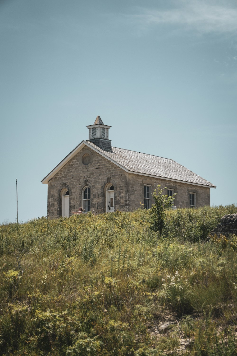 an old church on top of a hill