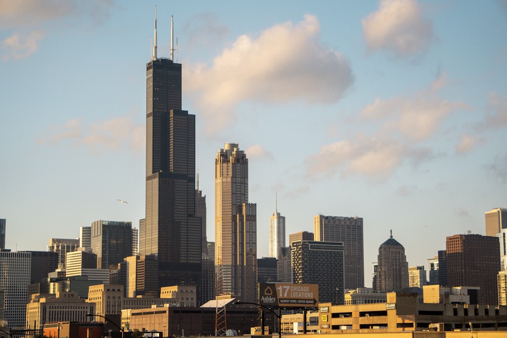 a city skyline with tall buildings in the foreground