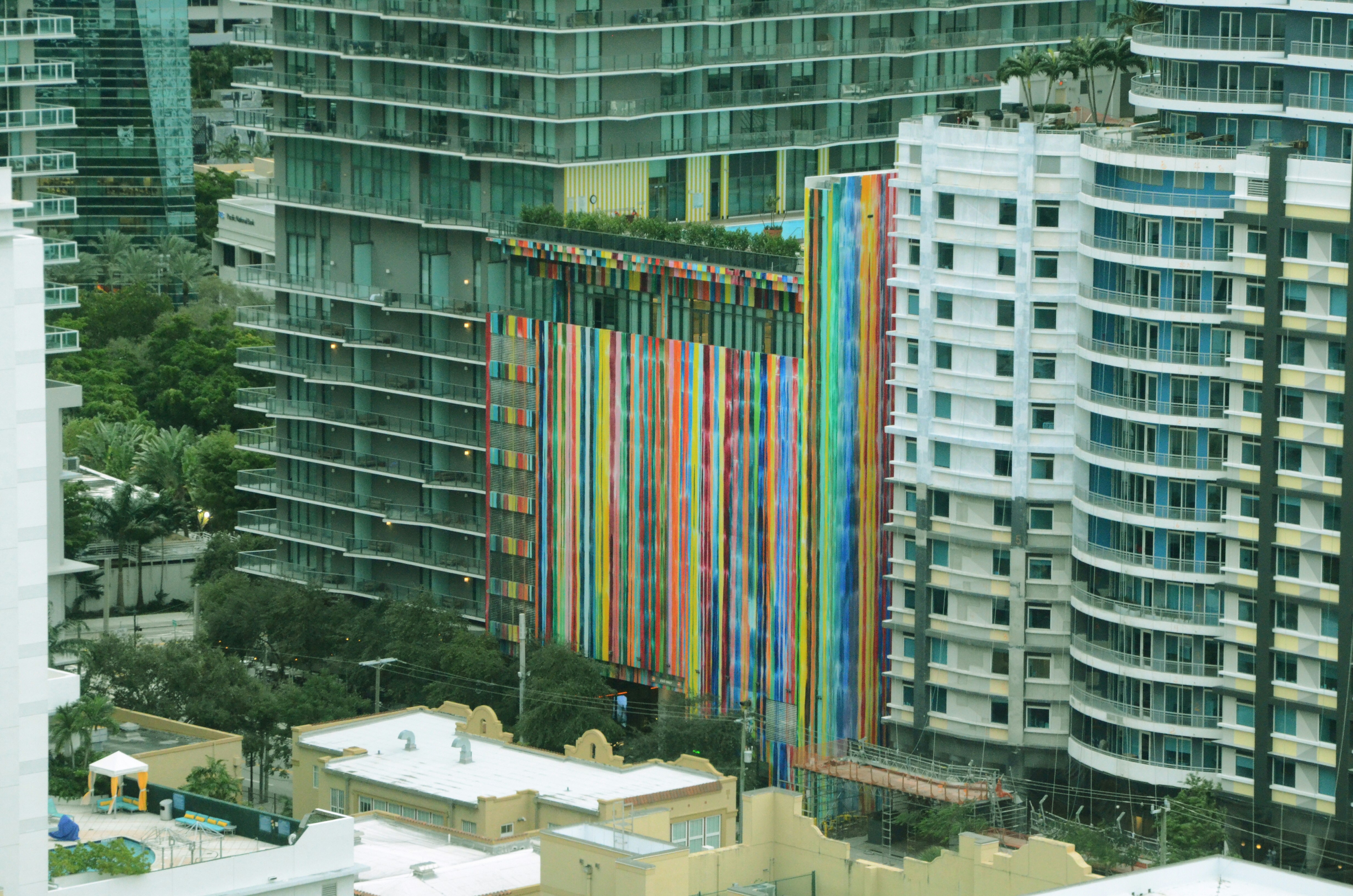 a large multicolored building in a city, 
