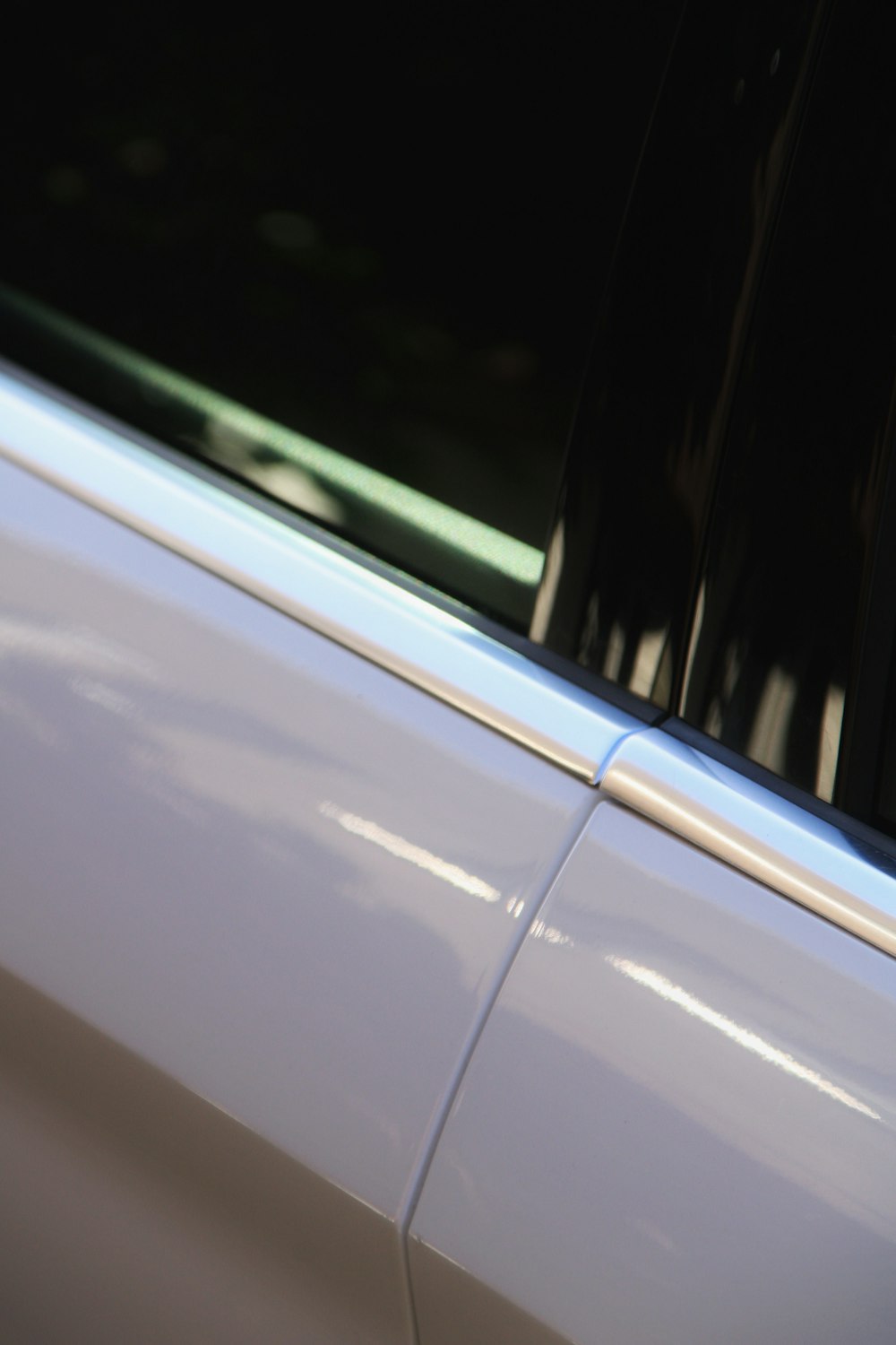 a close up of the side of a white car