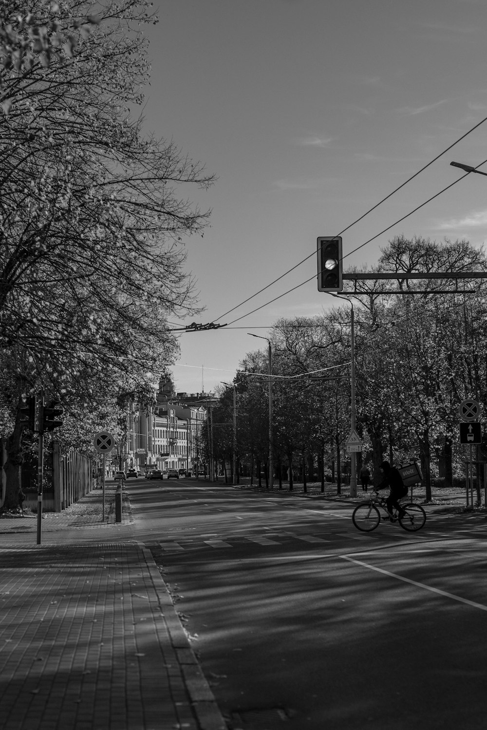 a person riding a bike down a street