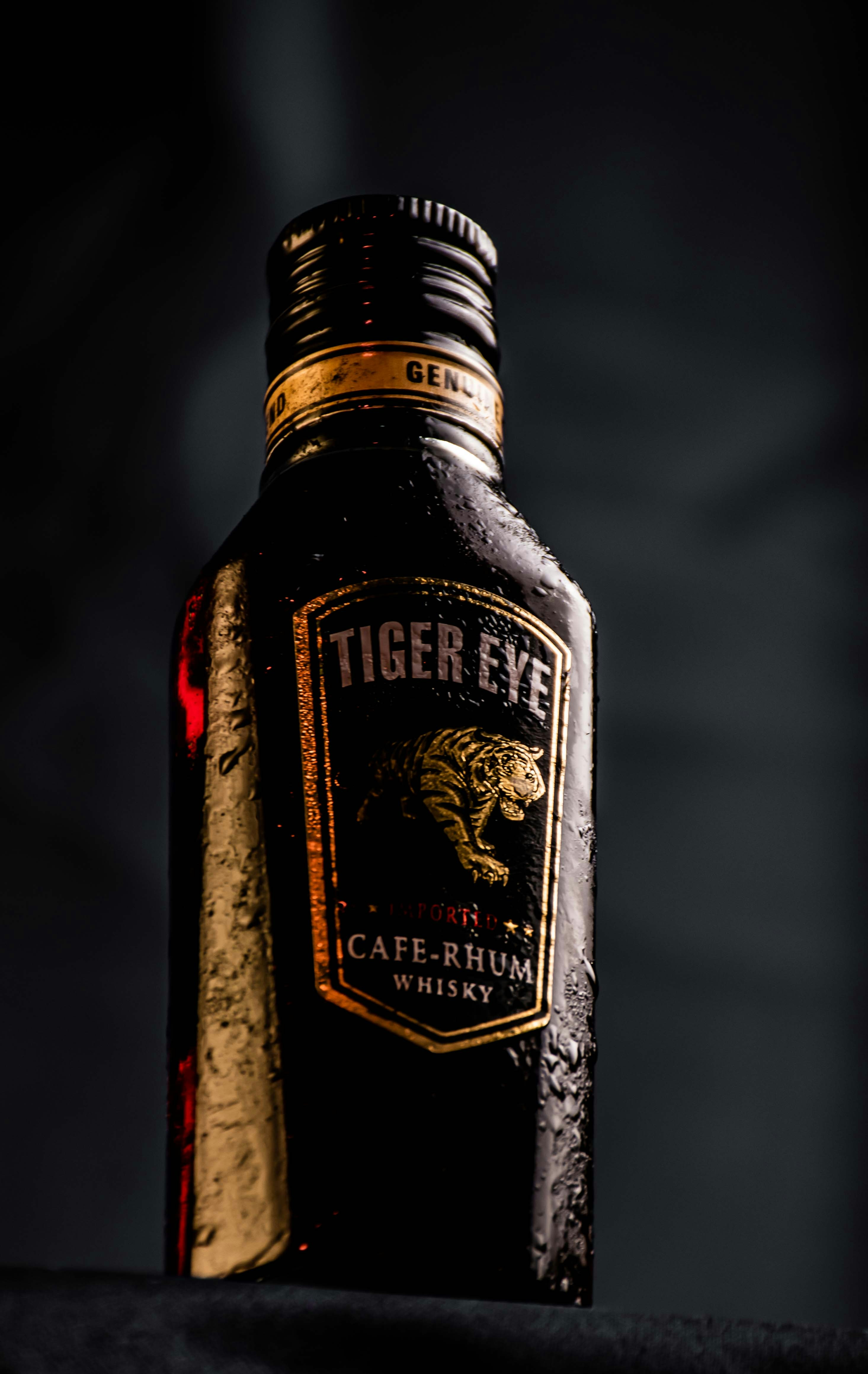 a close up of a bottle of liquor on a table