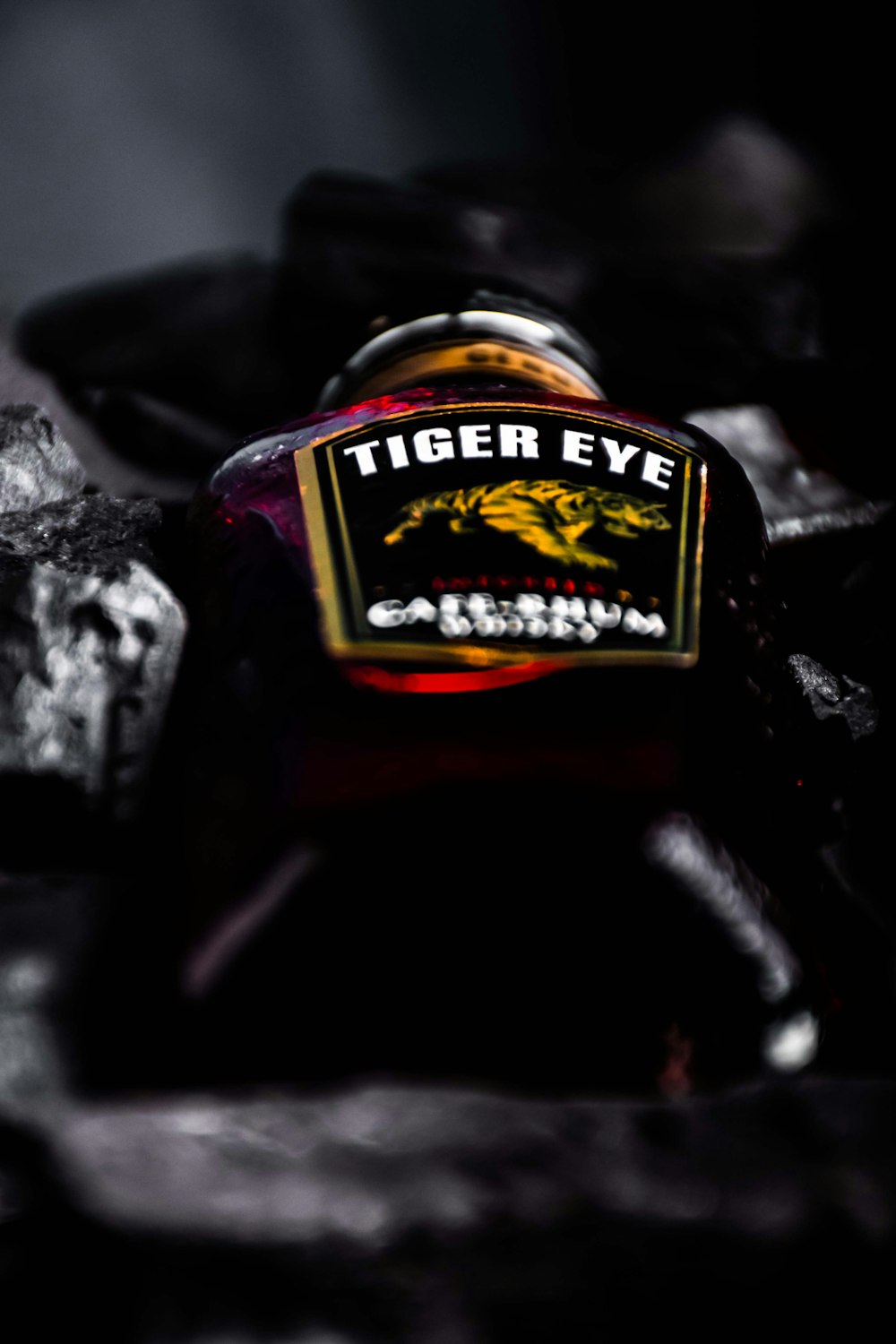 a tiger eye bottle sitting on top of a table
