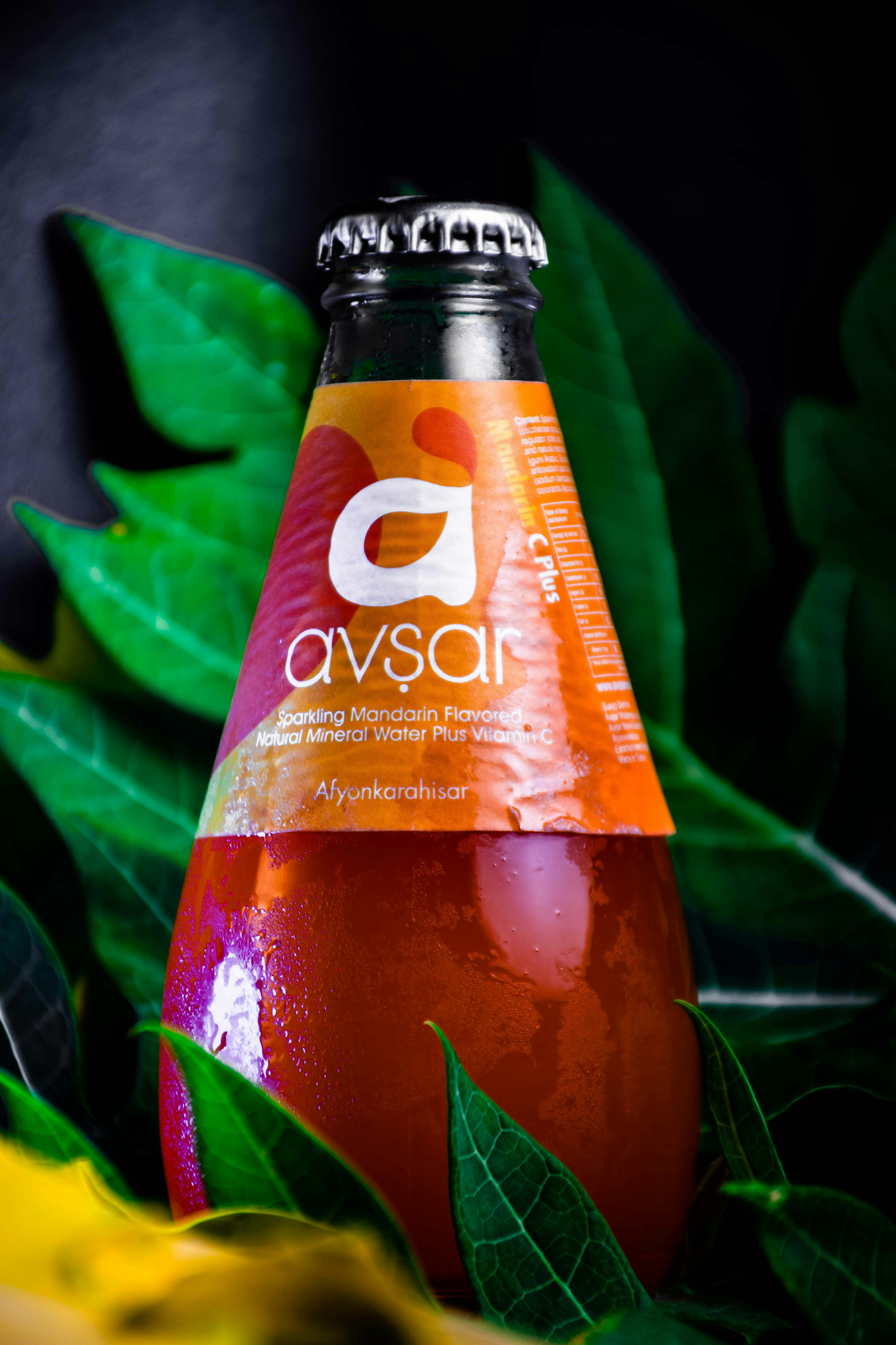 a bottle of orange juice sitting on top of a table