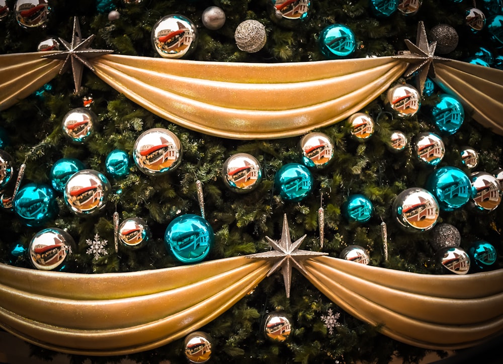 a close up of a christmas tree with ornaments