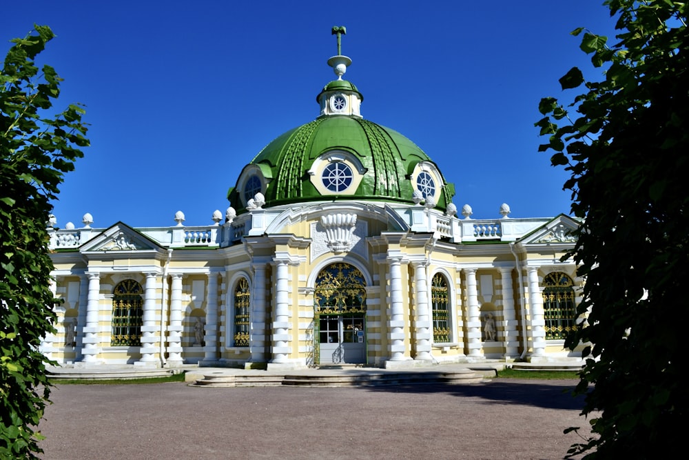 a large building with a green dome on top of it