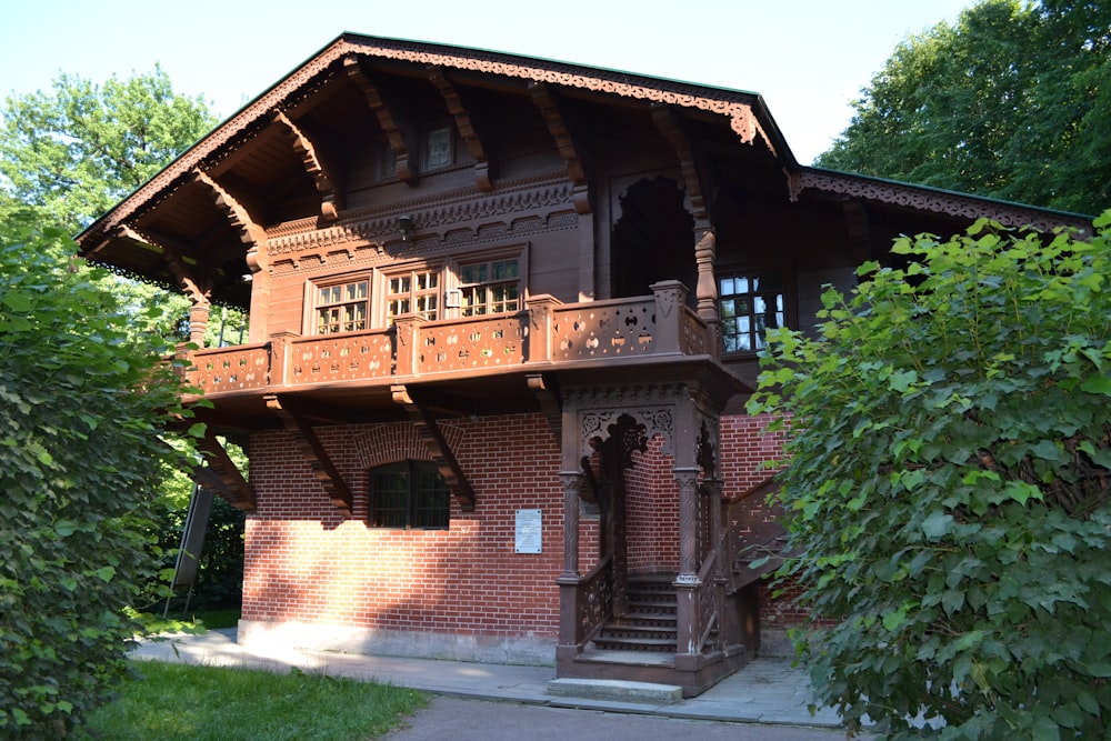 a wooden building with a balcony and a balcony