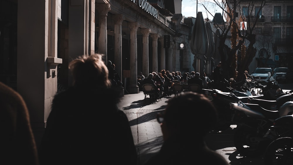 a group of motorcycles parked on the side of a street