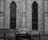 An elegant black and white photo of the original Park Place Motoring dealership.