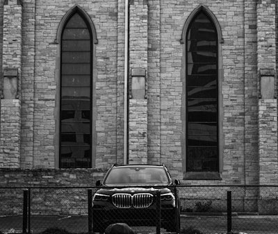 An elegant black and white photo of the original Park Place Motoring dealership.