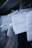 Several documents with Cyrillic text are visible, placed in a stack with clear plastic packaging around them. The focus is on a receipt or invoice in Russian, featuring printed and handwritten text.