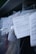 Several documents with Cyrillic text are visible, placed in a stack with clear plastic packaging around them. The focus is on a receipt or invoice in Russian, featuring printed and handwritten text.