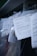 Several documents with Cyrillic text are visible, placed in a stack with clear plastic packaging around them. The focus is on a receipt or invoice in Russian, featuring printed and handwritten text.