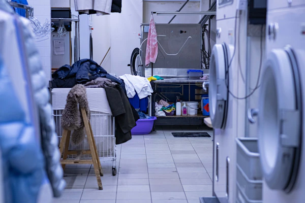 a laundry room filled with lots of clothes