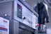 Close-up of a Samsung washing machine being serviced.