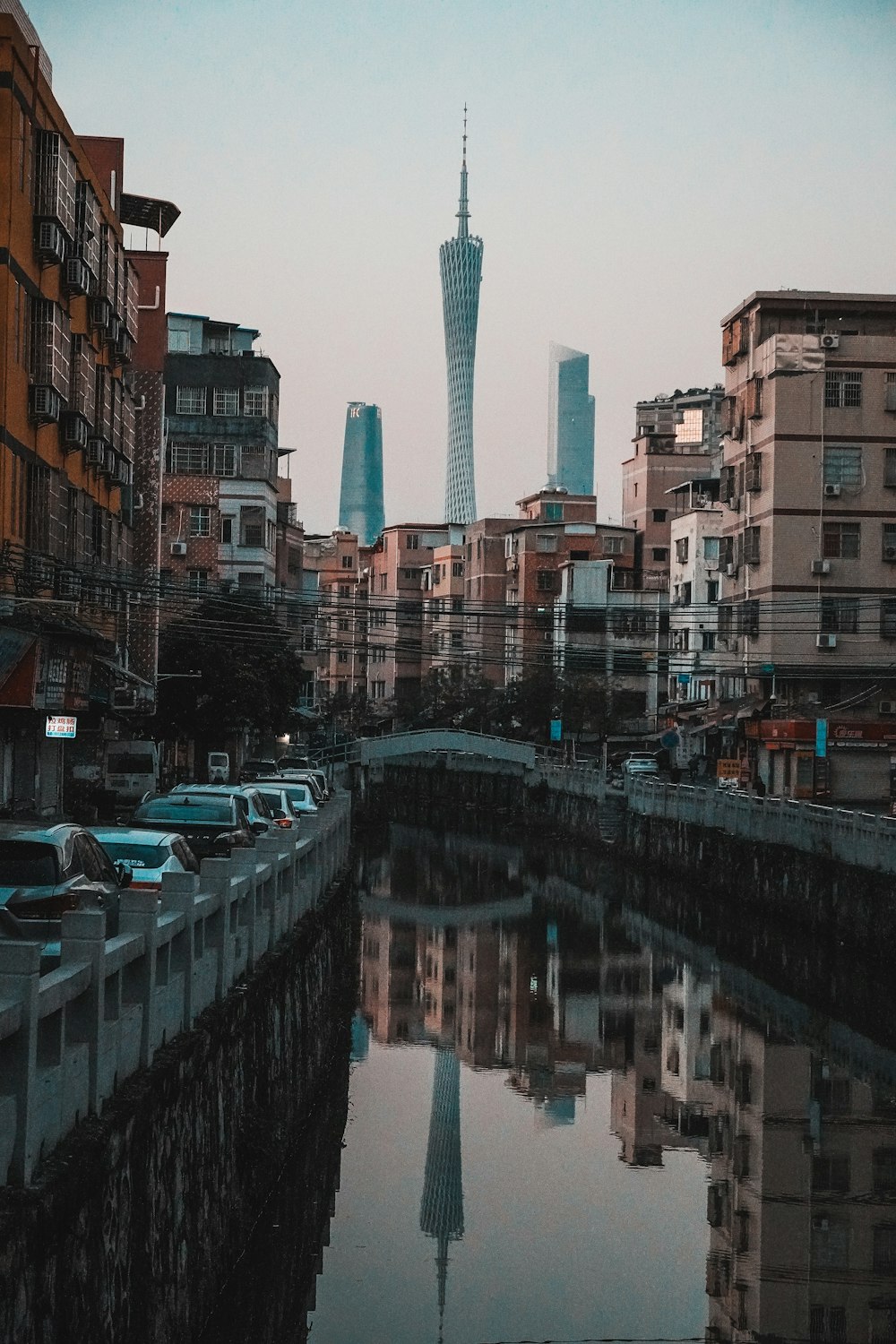 a body of water surrounded by tall buildings