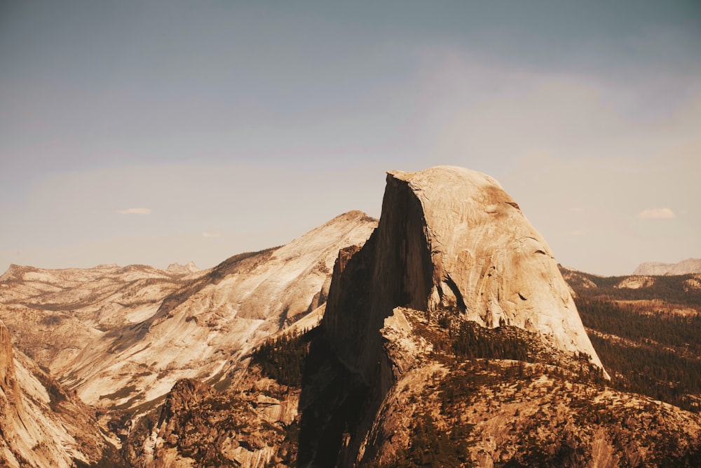 a mountain with a very tall rock in the middle of it