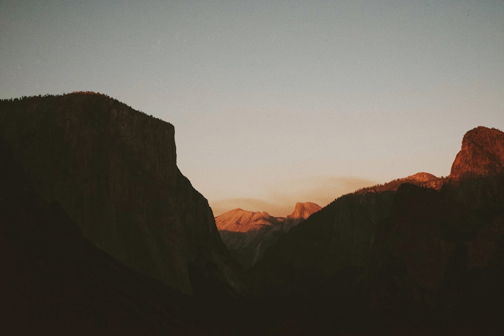 a view of a mountain range at sunset