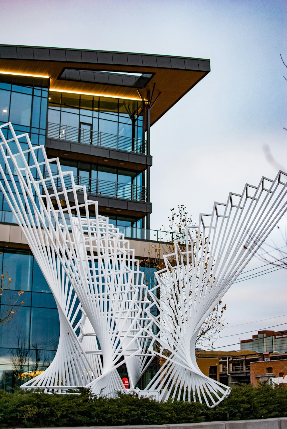a large white sculpture in front of a building