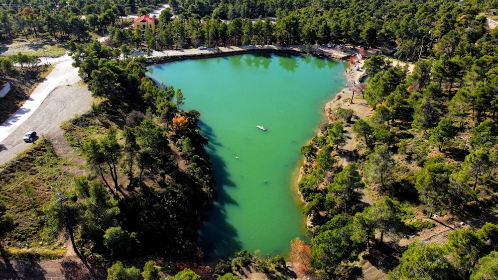 an aerial view of a lake surrounded by trees