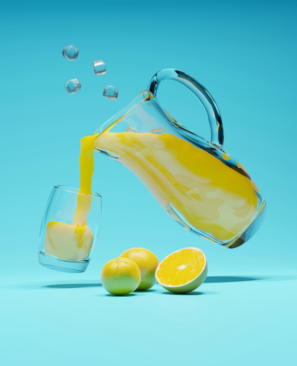 a pitcher pouring lemon juice into a glass