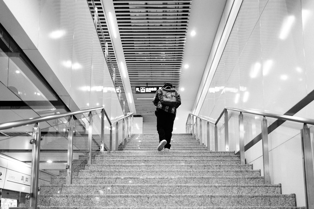 a woman walking down a flight of stairs